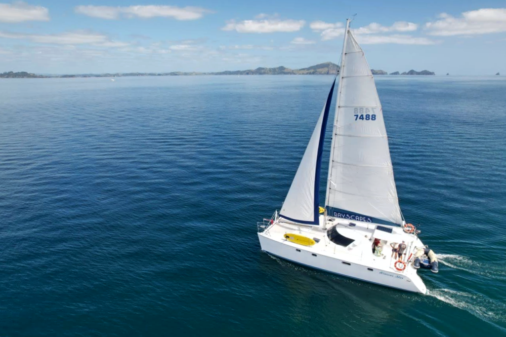 Scenic Sailing in the Bay of Islands Catamaran sailing through the Bay of Islands on a clear day