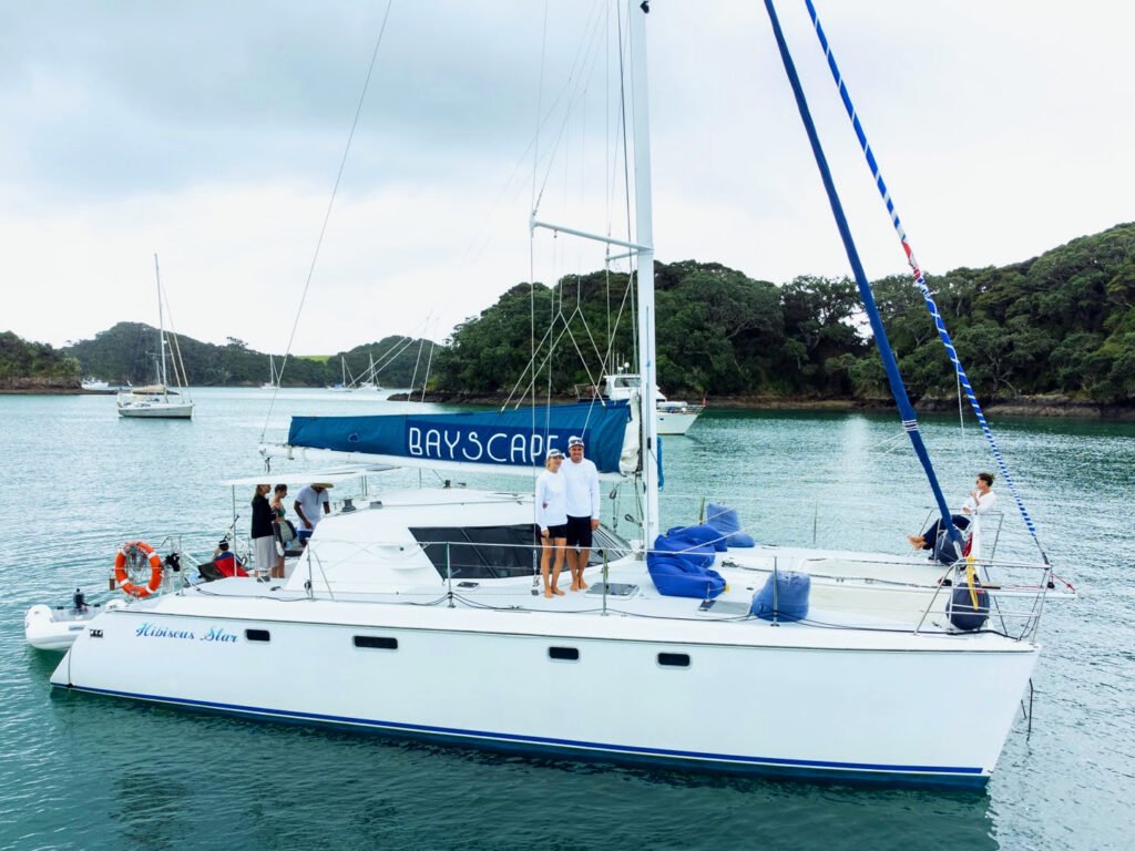 Bayscapes Charters crew Brad and Monique onboard Hibiscus Star, a sailing catamaran in the Bay of Islands