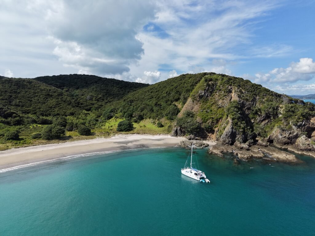 Bayscapes Sailing Charters catamaran Hibiscus Star anchored in a secluded Bay of Islands cove