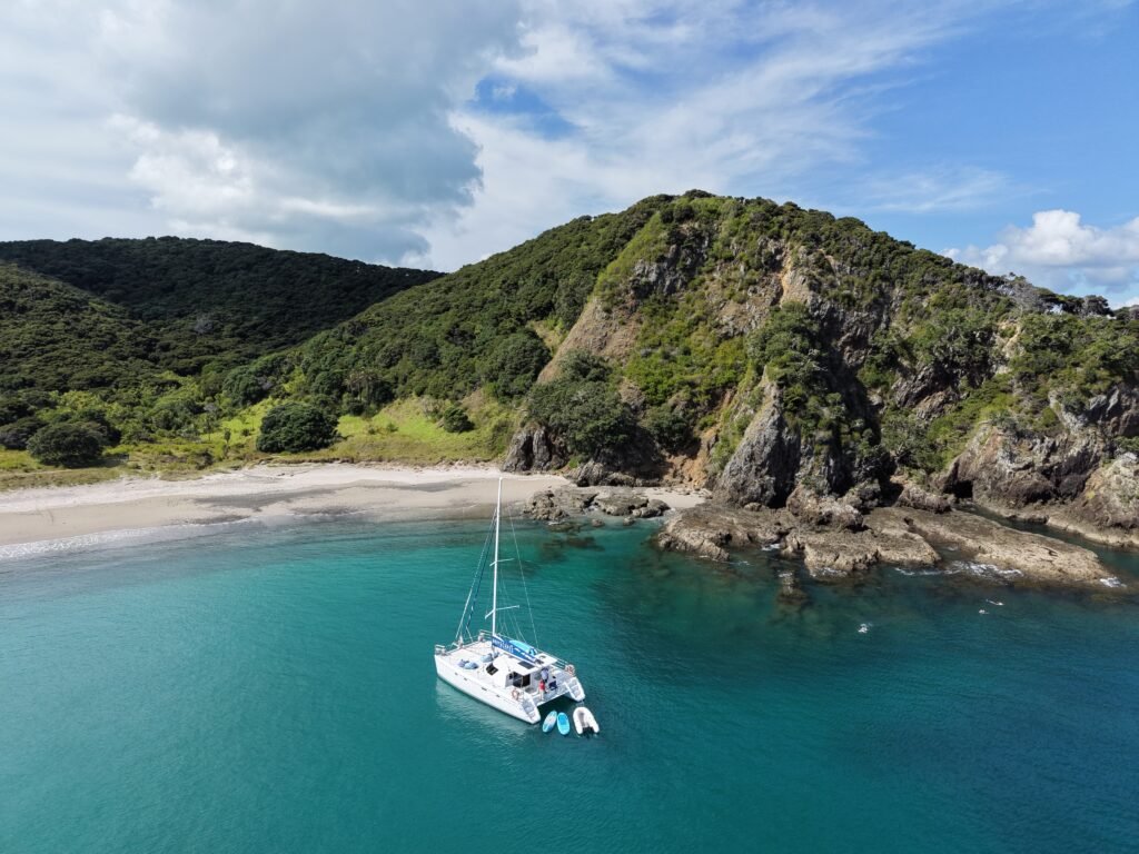 Bayscapes Sailing Charters catamaran Hibiscus Star anchored in a secluded Bay of Islands cove