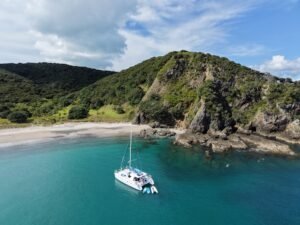 Bayscapes Sailing Charters catamaran Hibiscus Star anchored in a secluded Bay of Islands cove