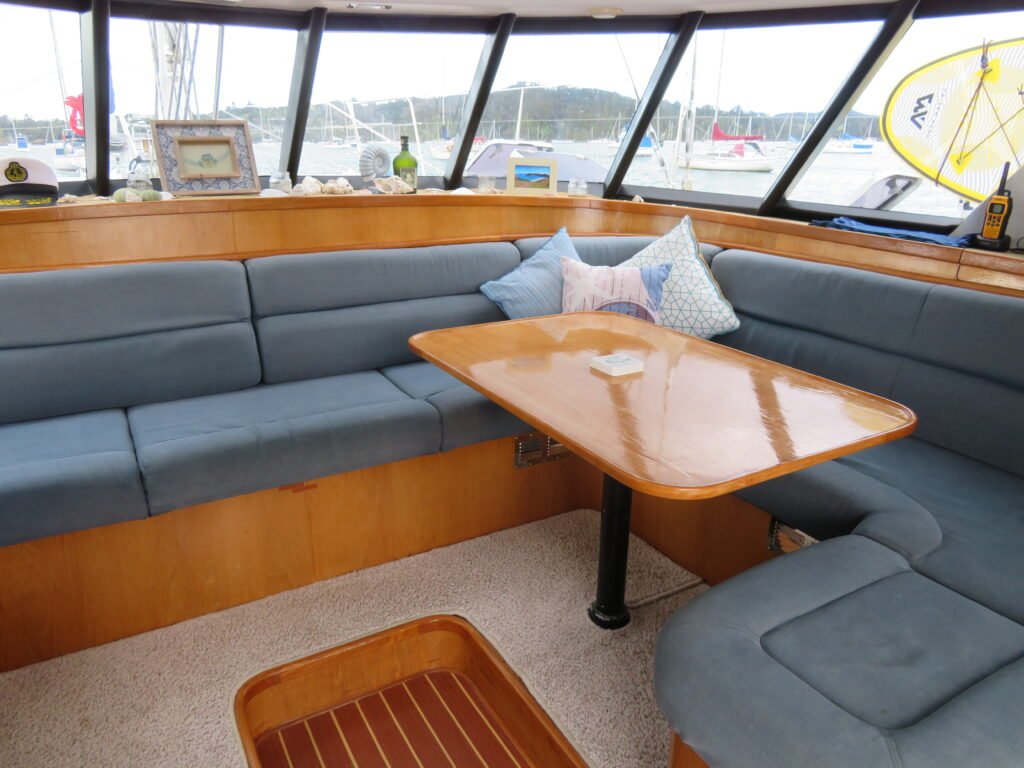 indoor seating area on a catamaran sailing charter in the bay of islands
