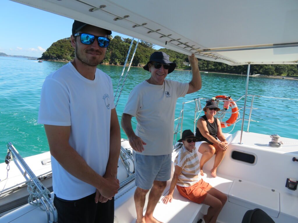 Guests enjoy an unforgettable moment onboard a sailing catamaran charter in the bay of islands