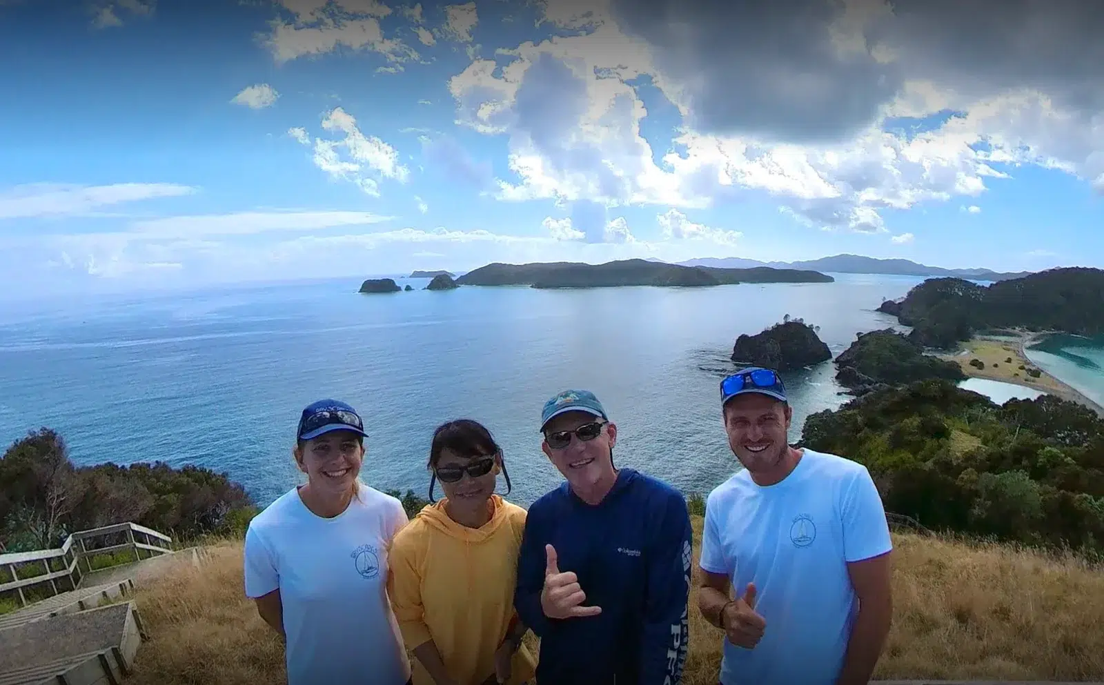 Happy guests enjoying a Bay of Islands sailing charter experience